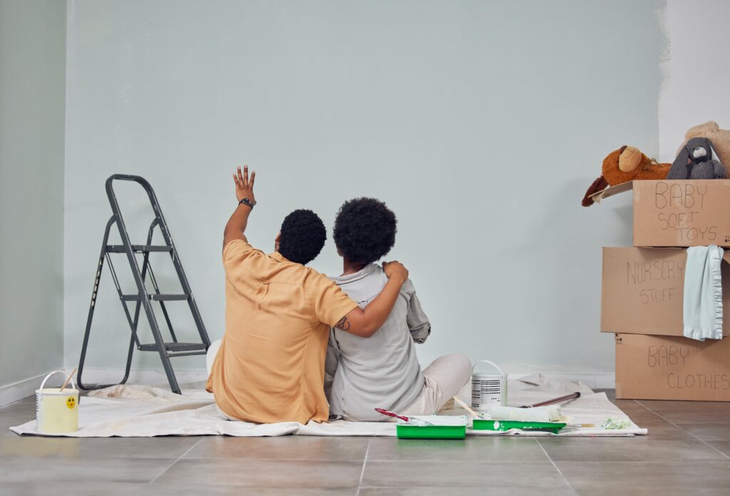 a man and woman sitting on the floor