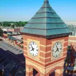 a clock tower with a pointy roof